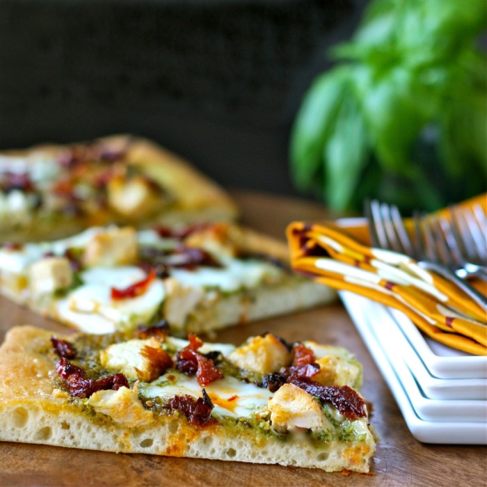 pesto pizza with chicken, mozzarella, and sun-dried tomatoes | daisy&amp;#39;s ...